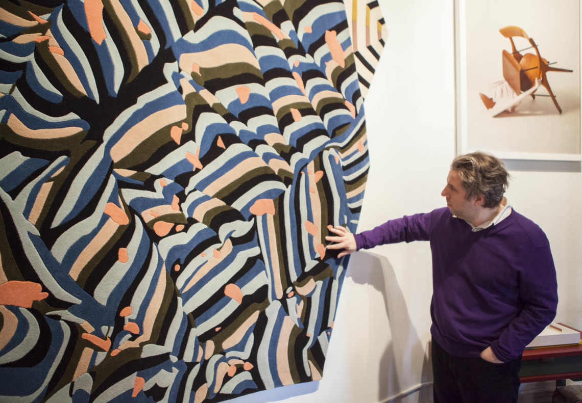NYSID ASID Student Tom Sembros getting a better feel for the 100% New Zealand wool 'Banner' rug