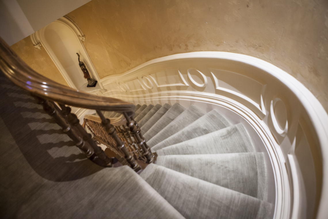 The swooping and intricately carved staircase. Photo Credit: Megan Swann, Editor at Large 